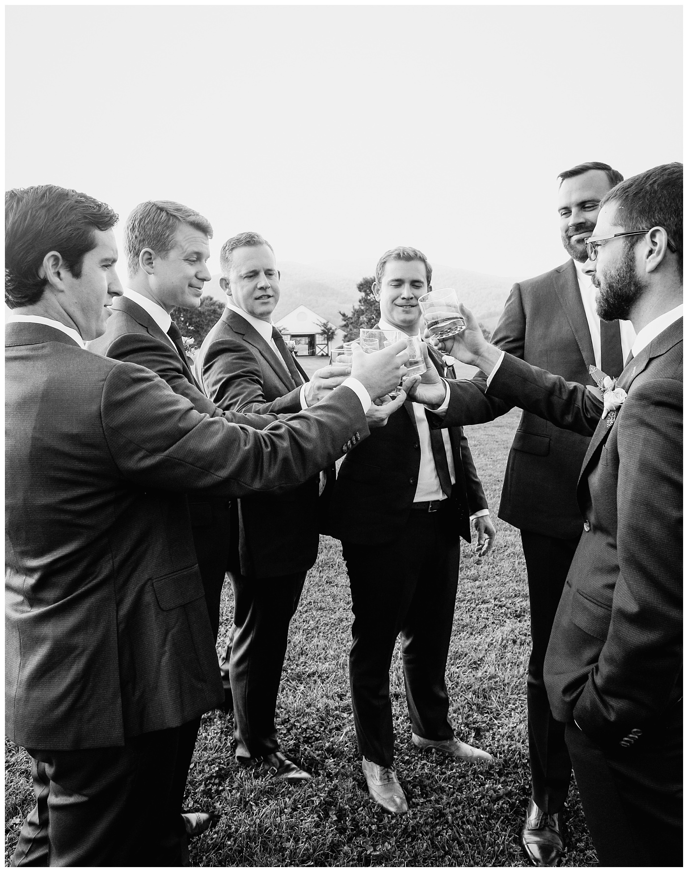 Groomsmen toasting whisky at King Family Vineyard Wedding. 