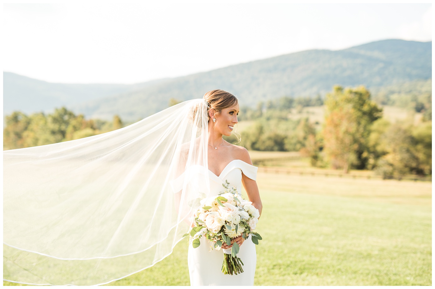 Bride veil blowing in the wind at King Family Vineyard. 