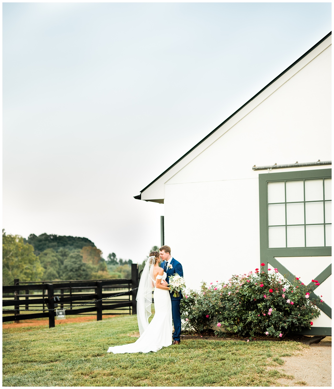 Bride and Groom portraits in front of the barn at King Family Vineyard.