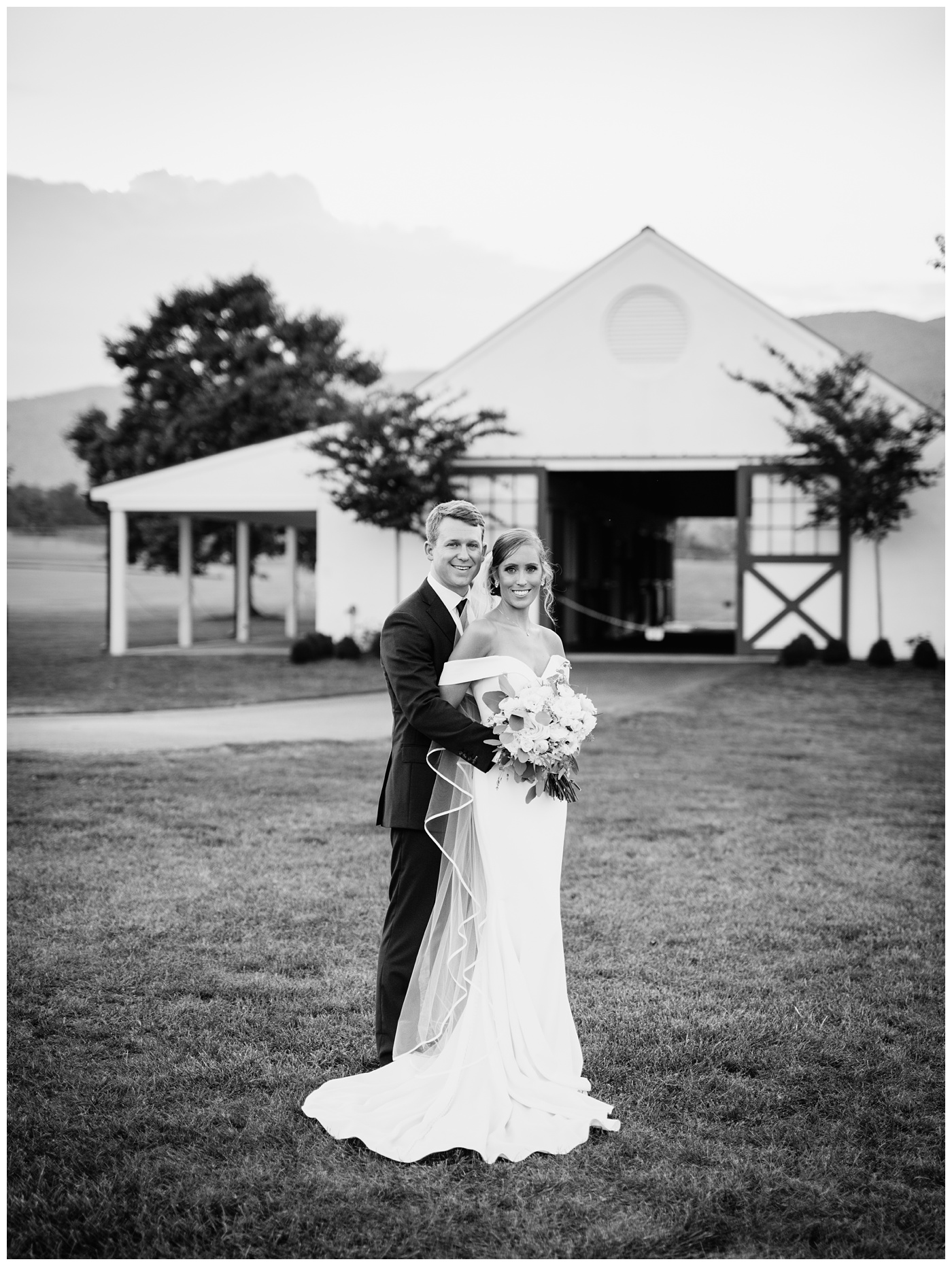 Bride and Groom portraits in front of the barn at King Family Vineyard.