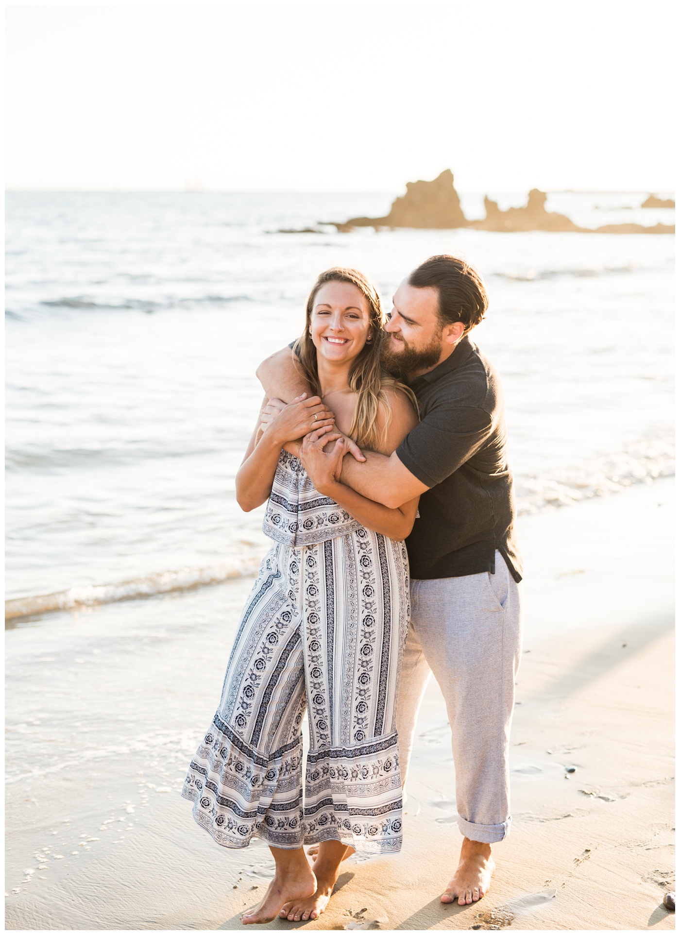 couple posing in Newport Beach sunset photos 