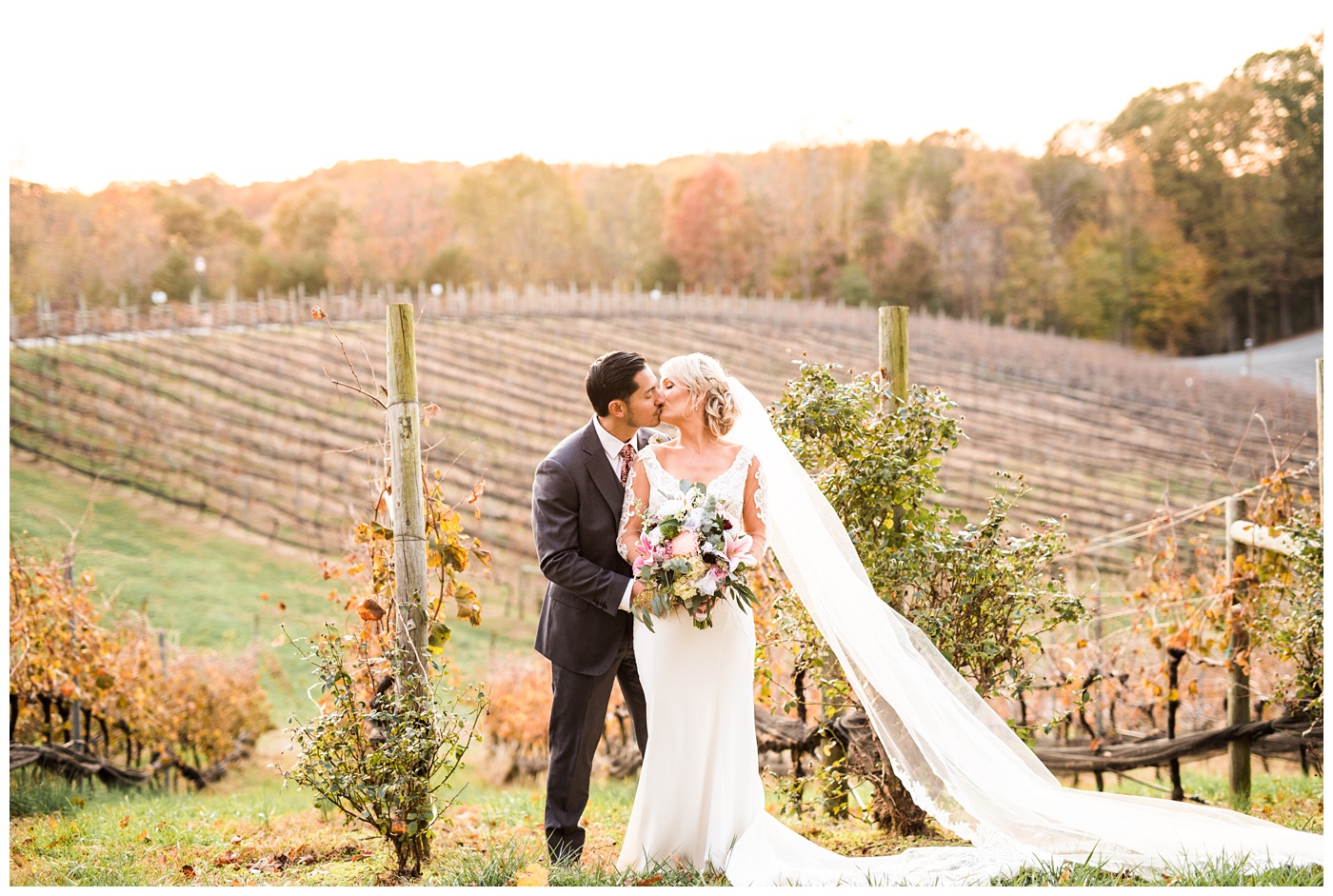 bride and groom kissing at sunset at potomac point winery