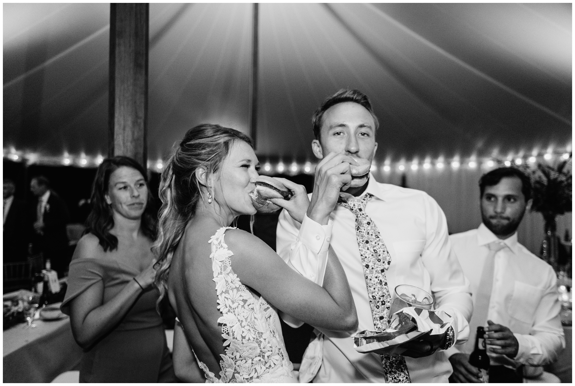 Couple eating Chick Fil A at their wedding reception