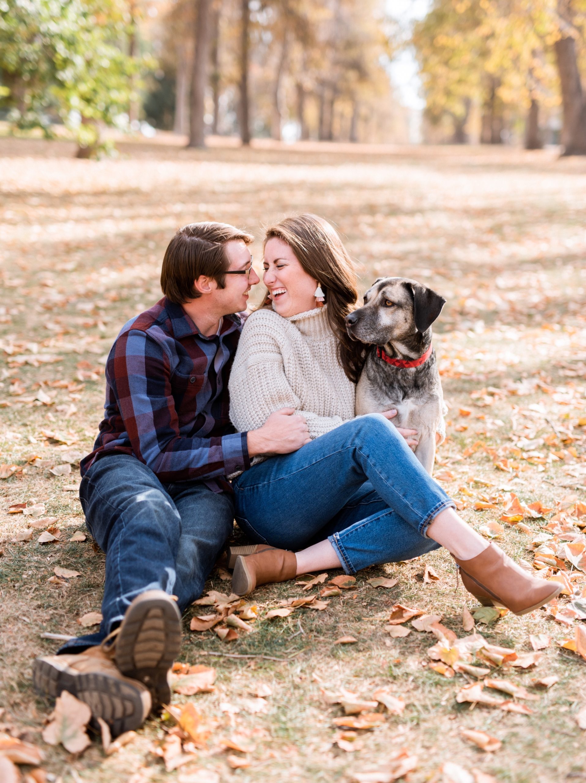 couple cuddled in Denver Colorado Fall photoshoot