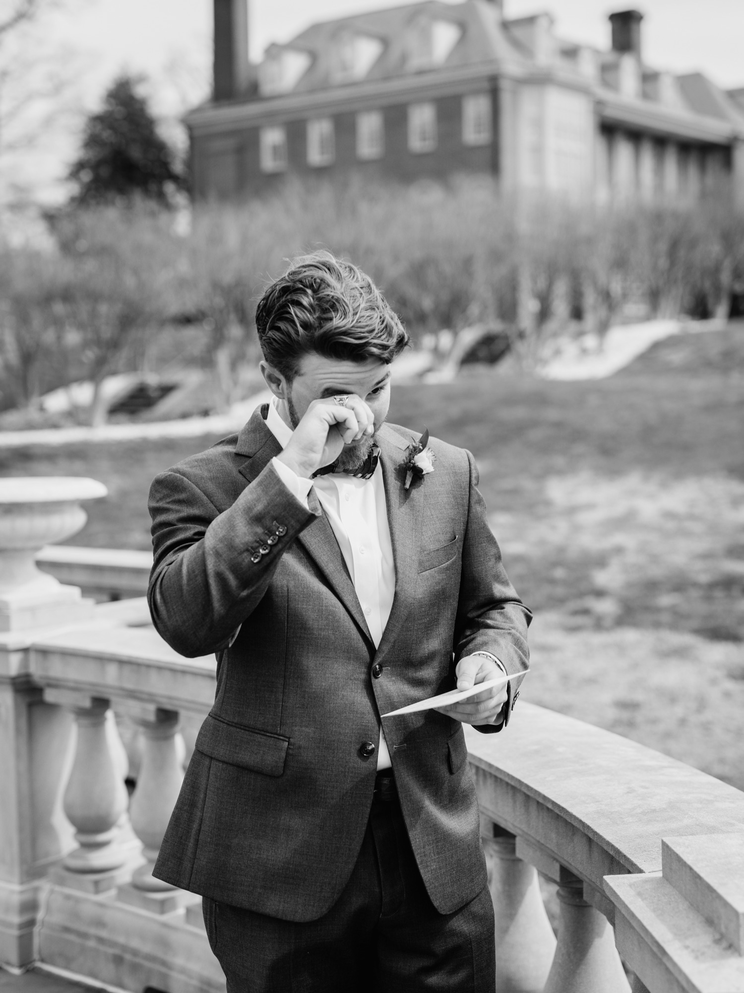 Groom reads letter from his bride at the Estate at River Run