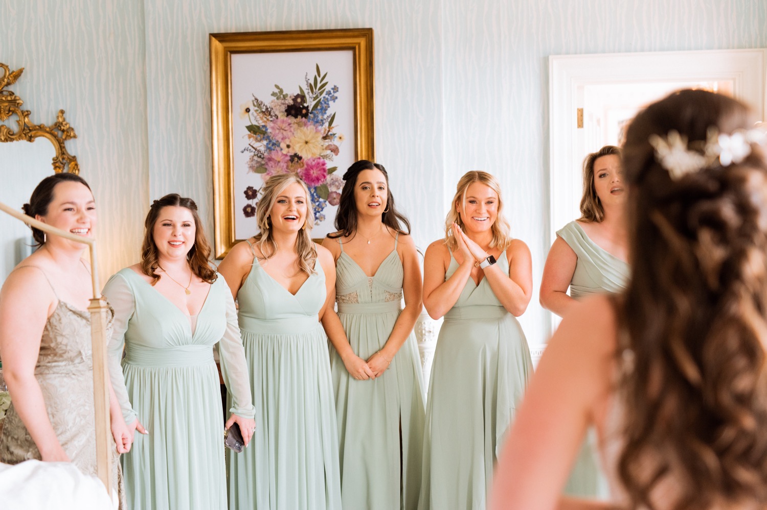 Bride leaves her bridal party in awe of her beauty as she gets ready at the Estate at River Run