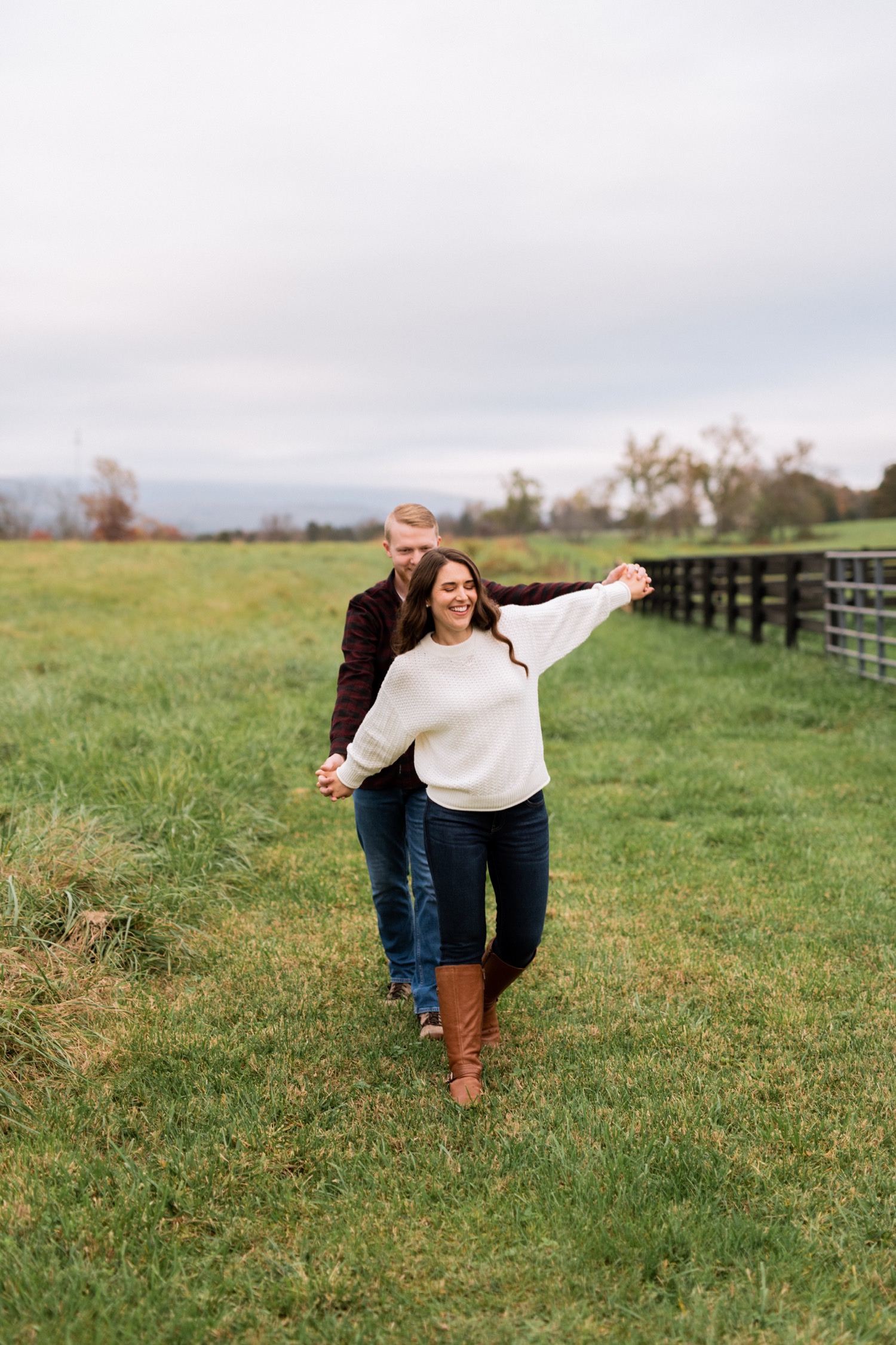 engaged couple hold each other close during photoshoot at Barn at Edgewood