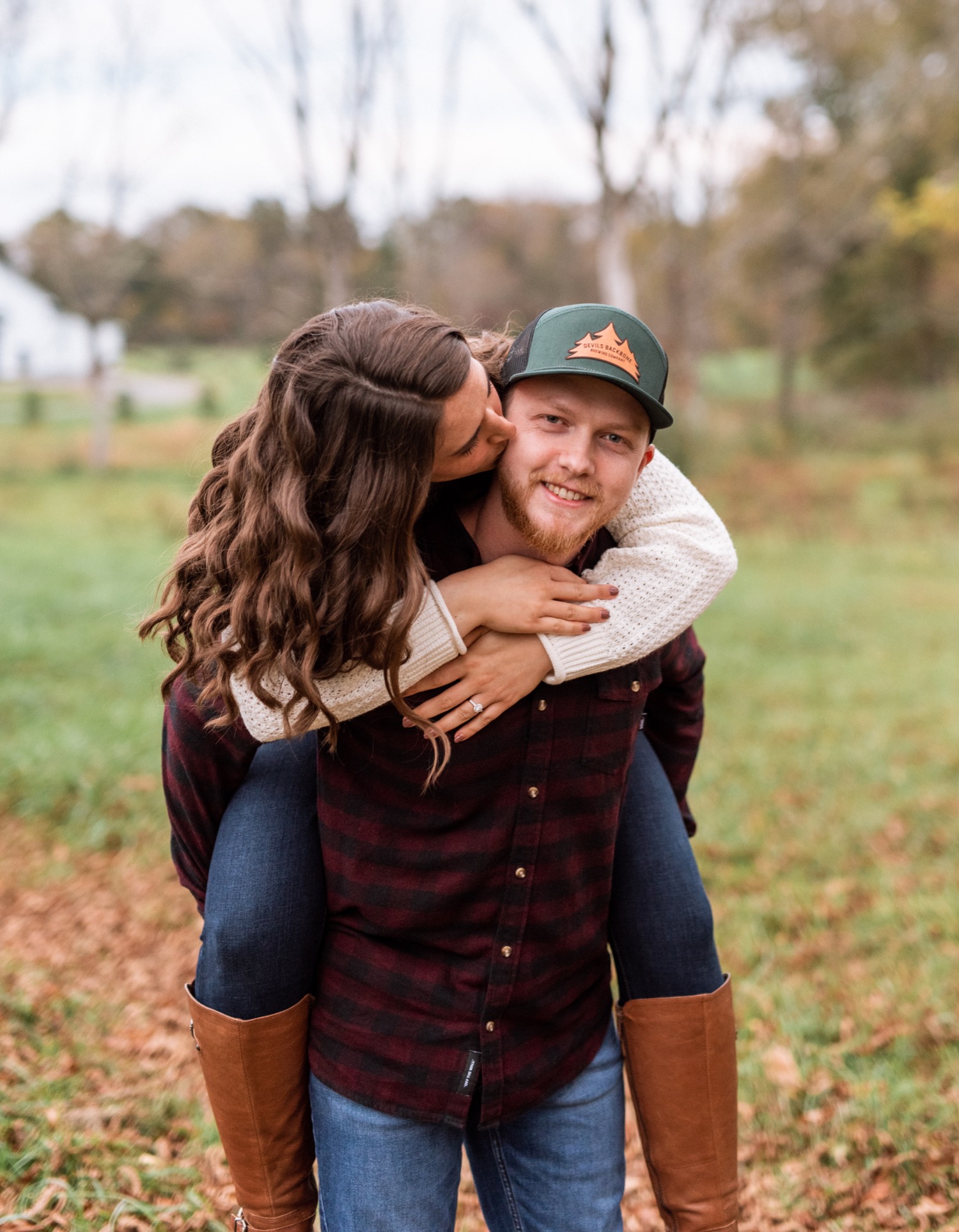 engaged couple hold each other close during photoshoot at Barn at Edgewood