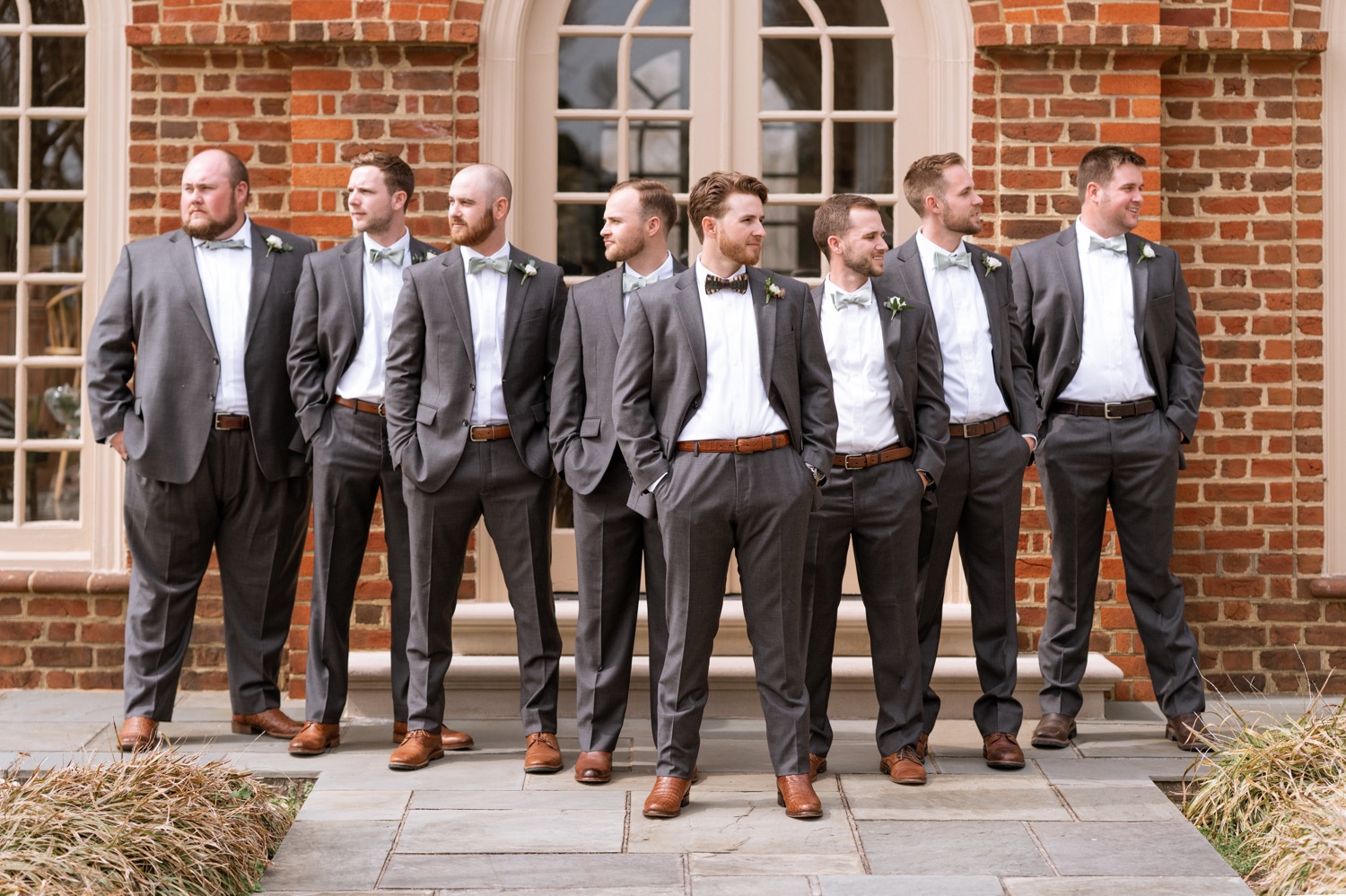 Groom and groomsmen looking dapper before the wedding at the Estate at River Run