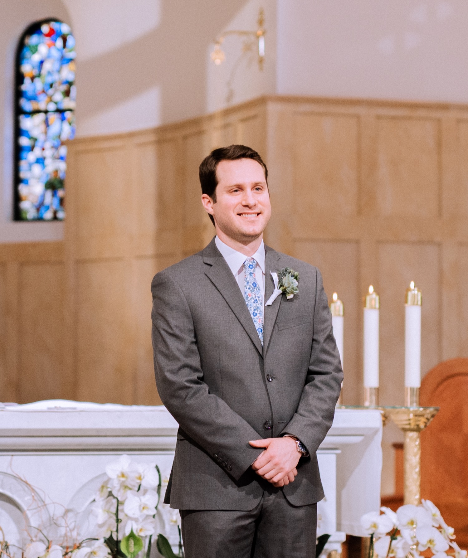 groom standing at the alter waiting for bride