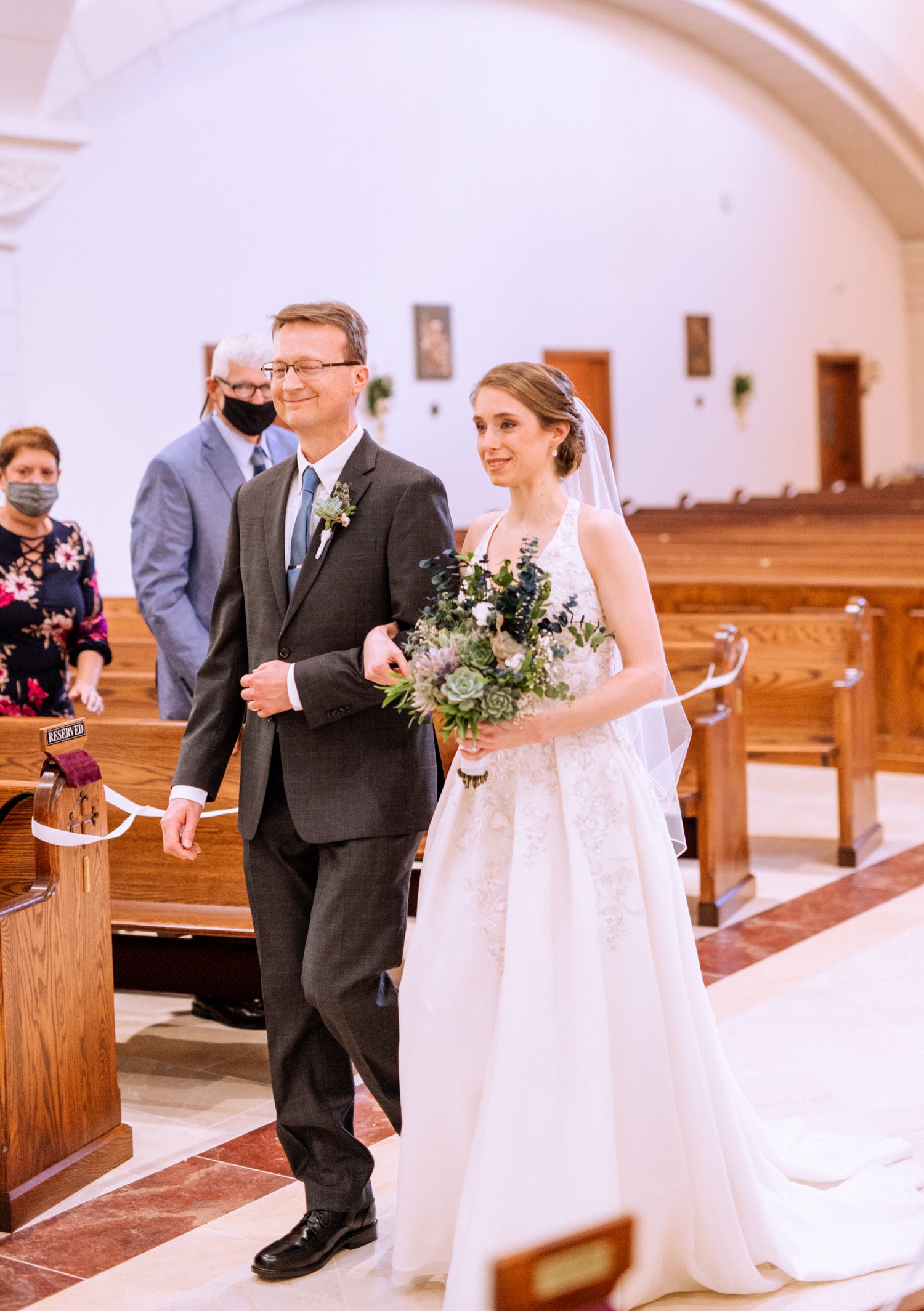 father walking his daughter down the aisle