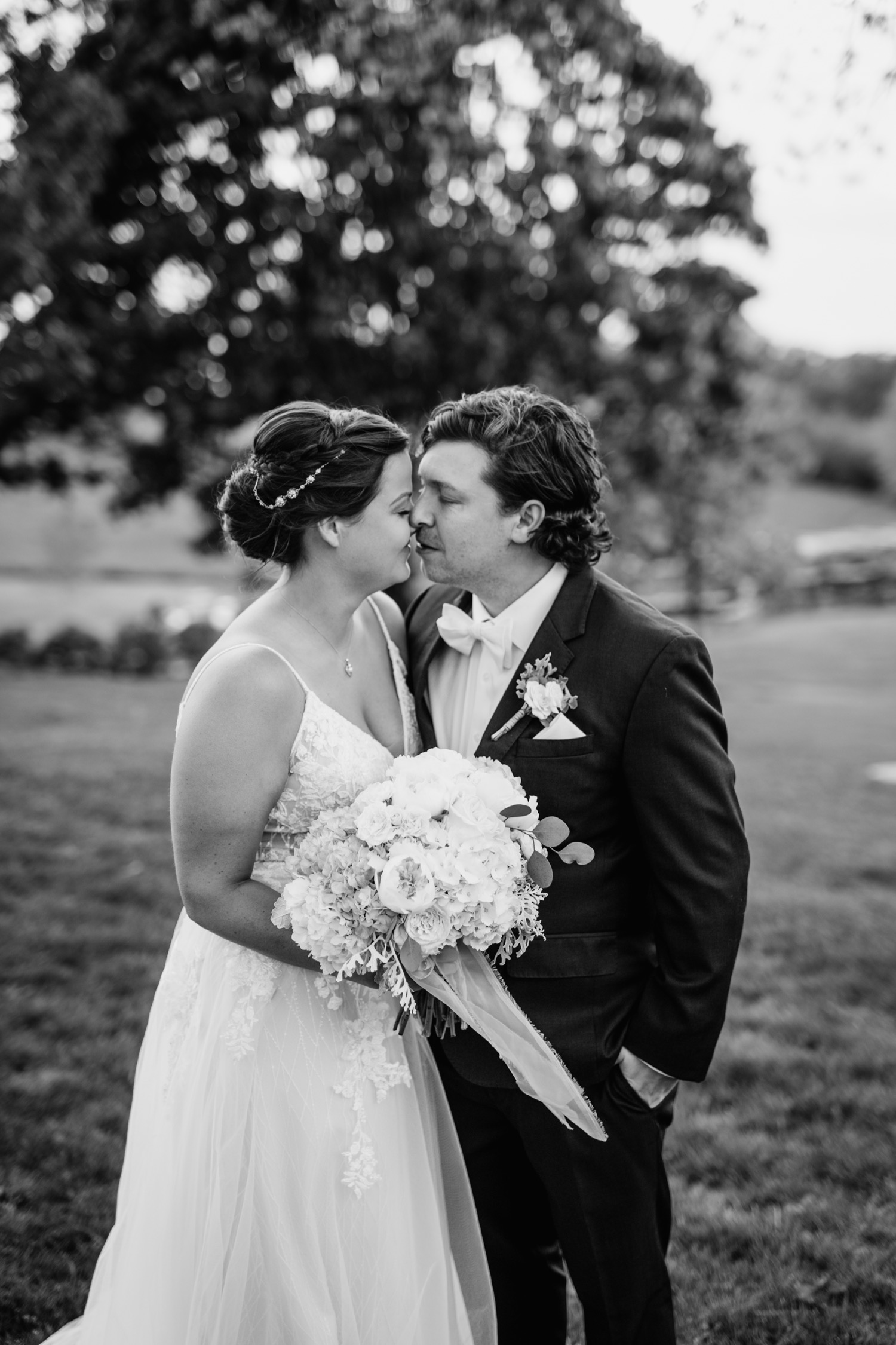 bride and groom kiss at Glen Ellen Farm wedding