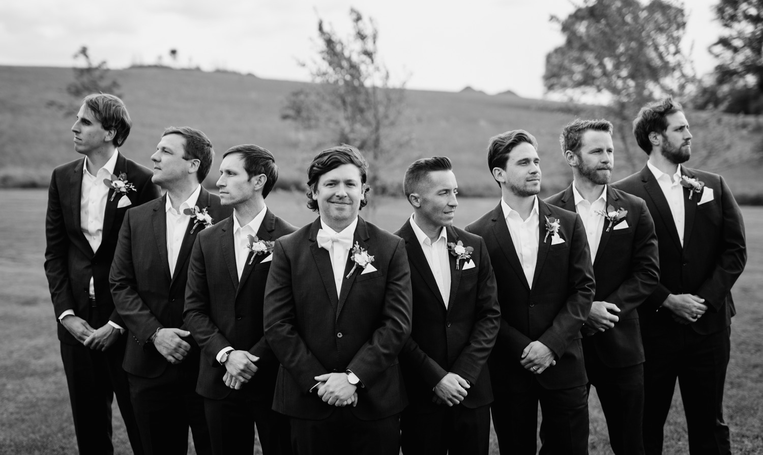 groom and groomsmen pose before Glen Ellen Farm wedding