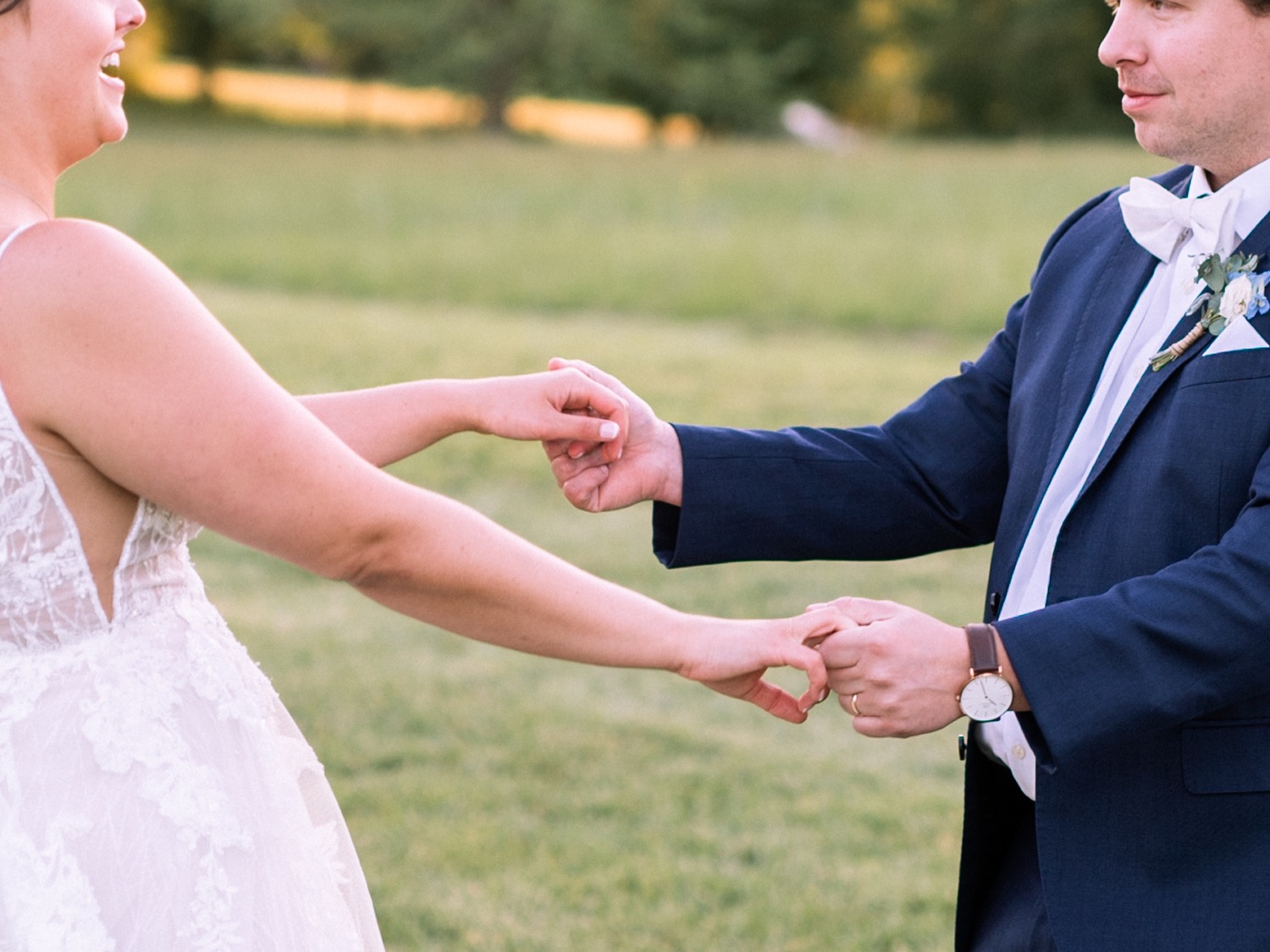 bride and groom hold hands at Glen Ellen Farm wedding