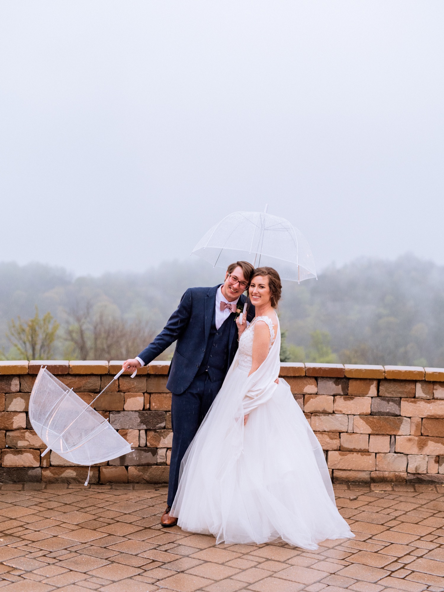 Bride and groom cuddle in the rain in Lexington Virginia