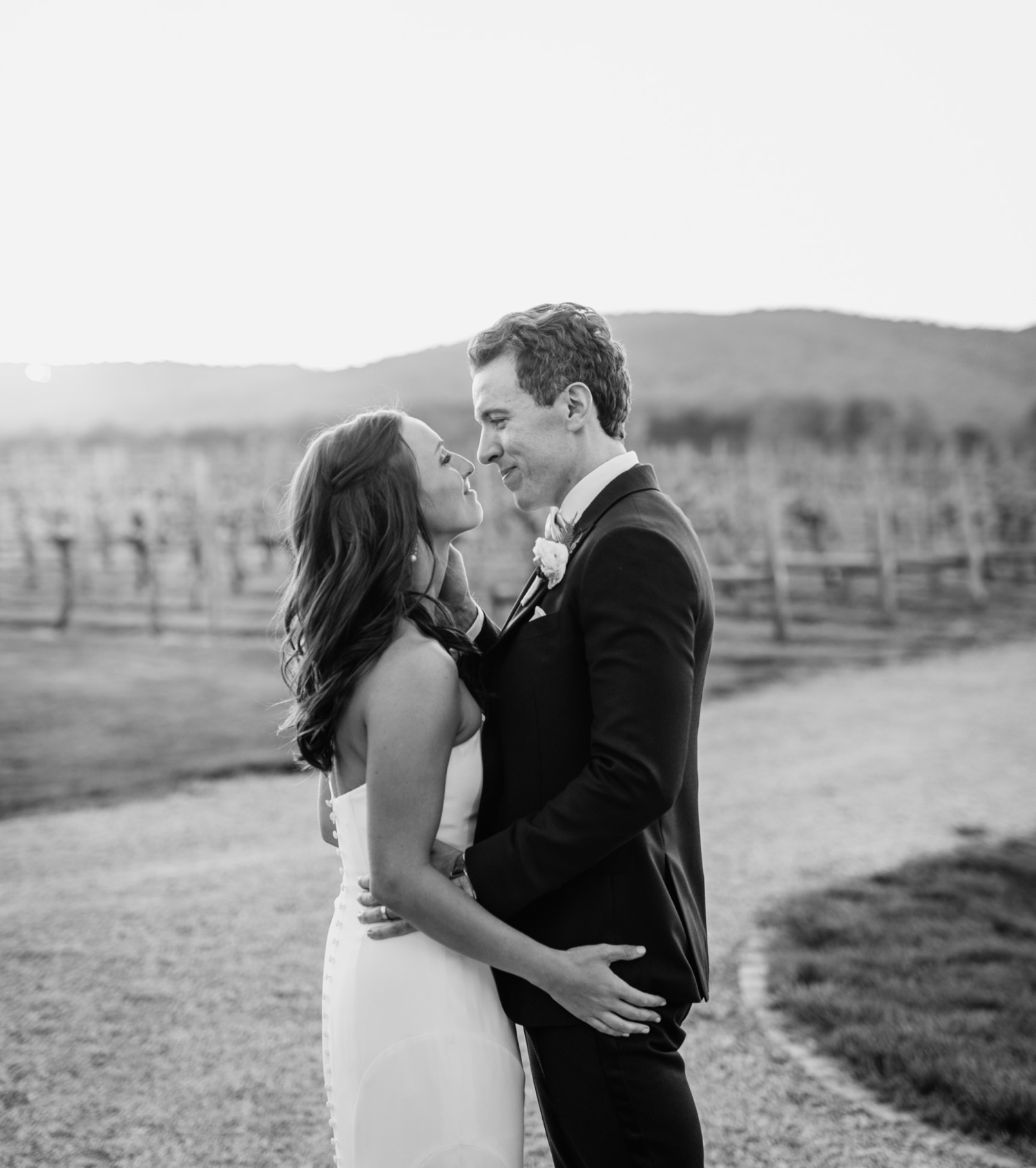 bride and groom look into each other's eyes at Keswick Vineyard wedding