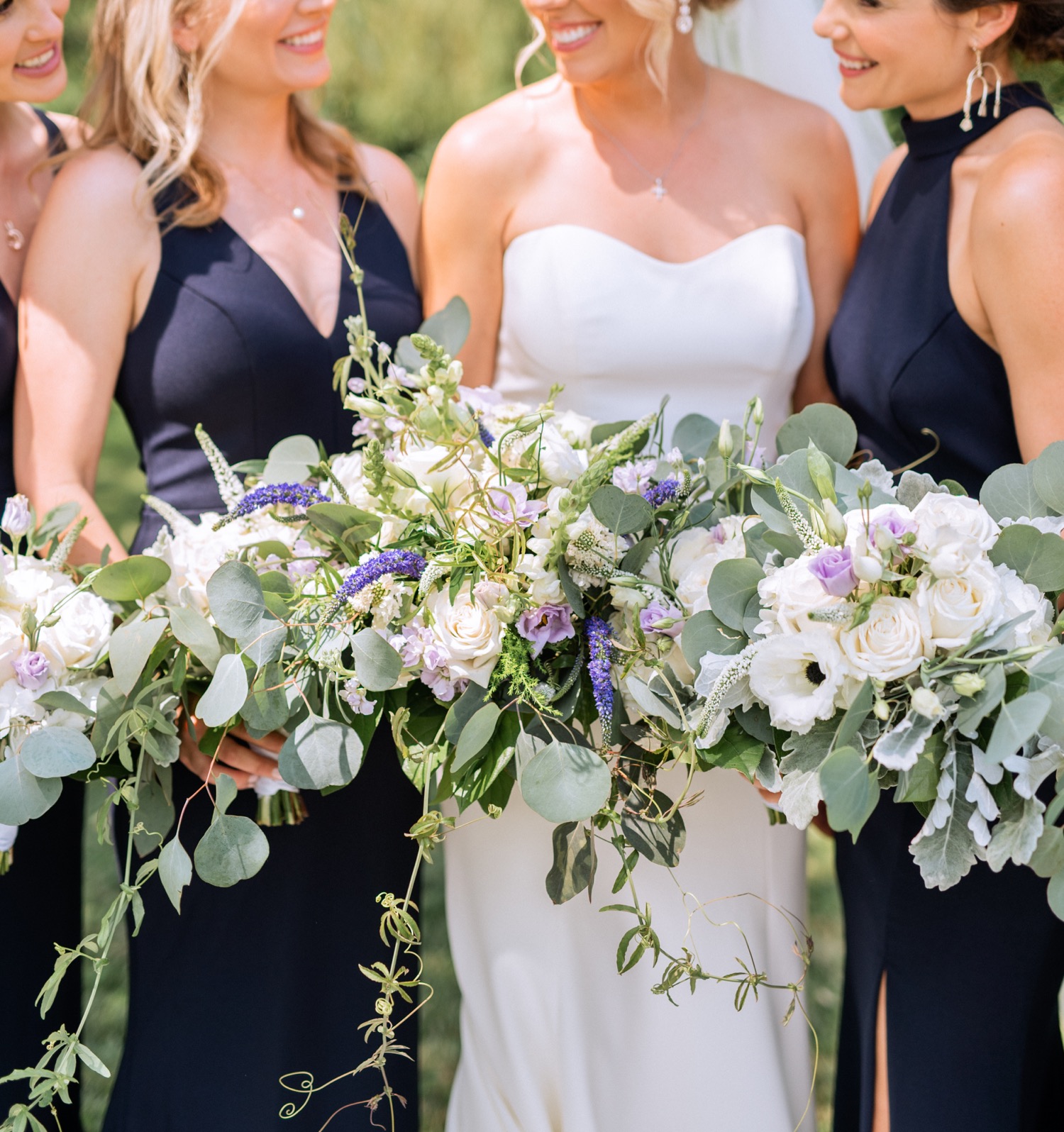 Close up shot of bride, bridesmaids, and their flowers before the wedding ceremony in Richmond, Virginia summer wedding