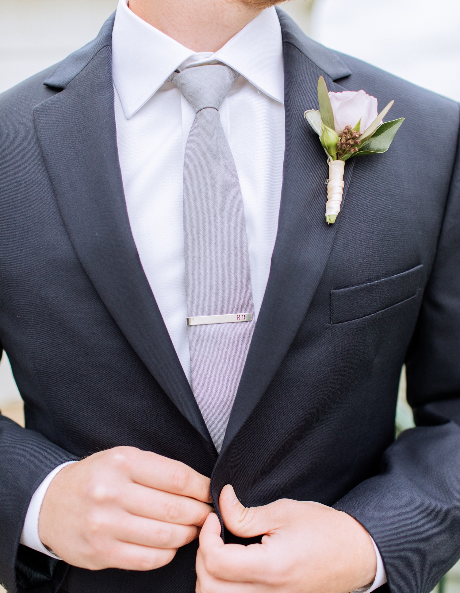 close up of the groom before his first look with this bride