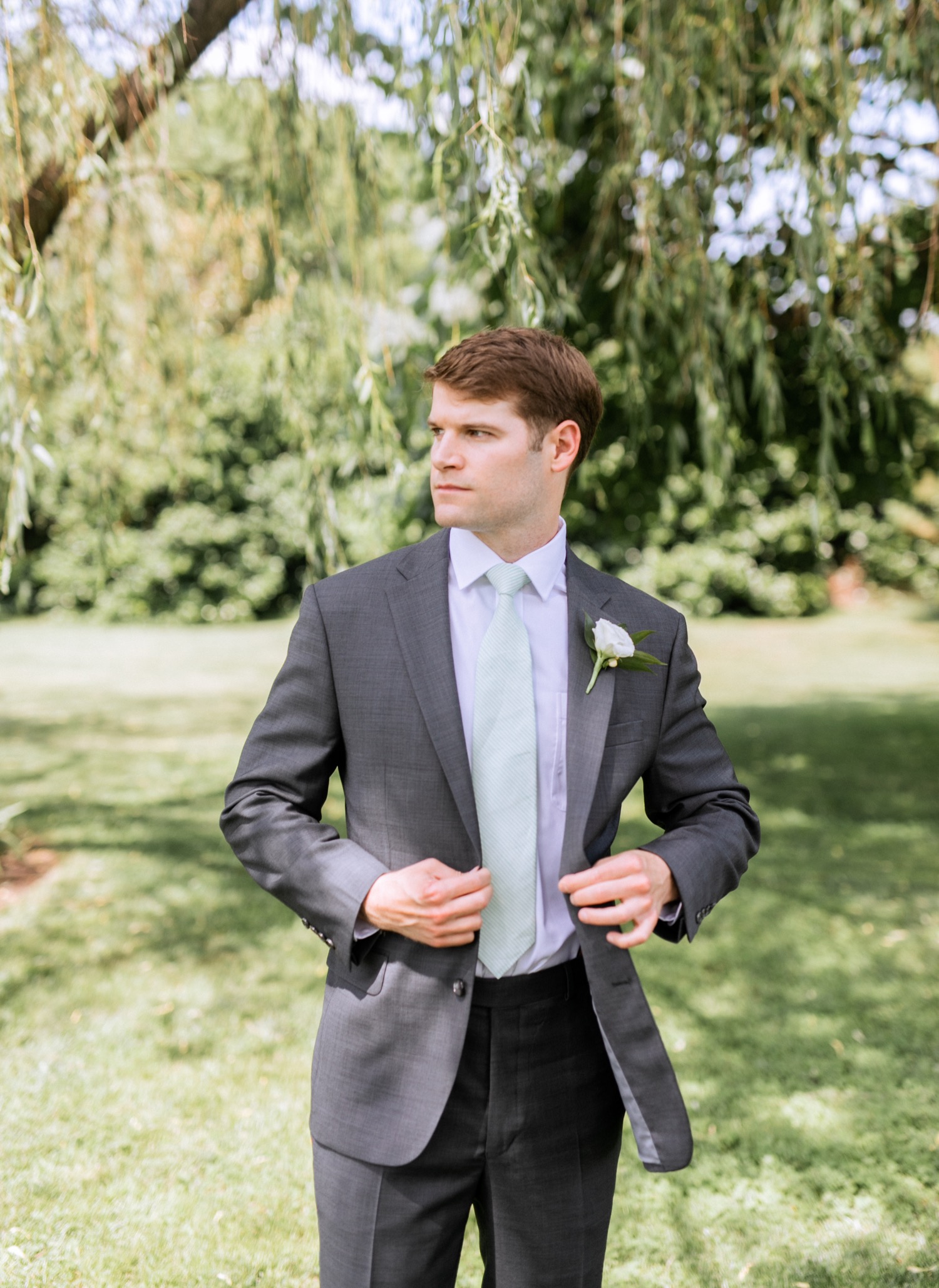 Groom poses before he heads to the alter for his summer wedding in Richmond, Virginia