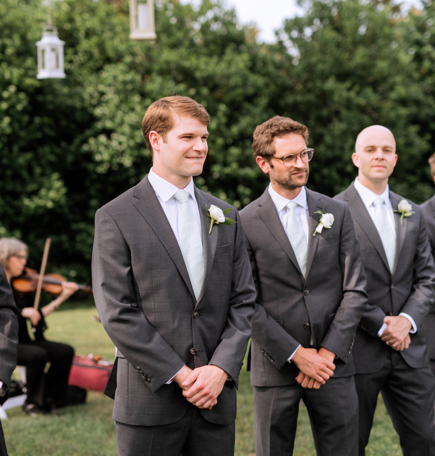 Groom standing at the alter awaiting his bride to walk down the aisle for their first look during their summer wedding in Richmond, Virginia