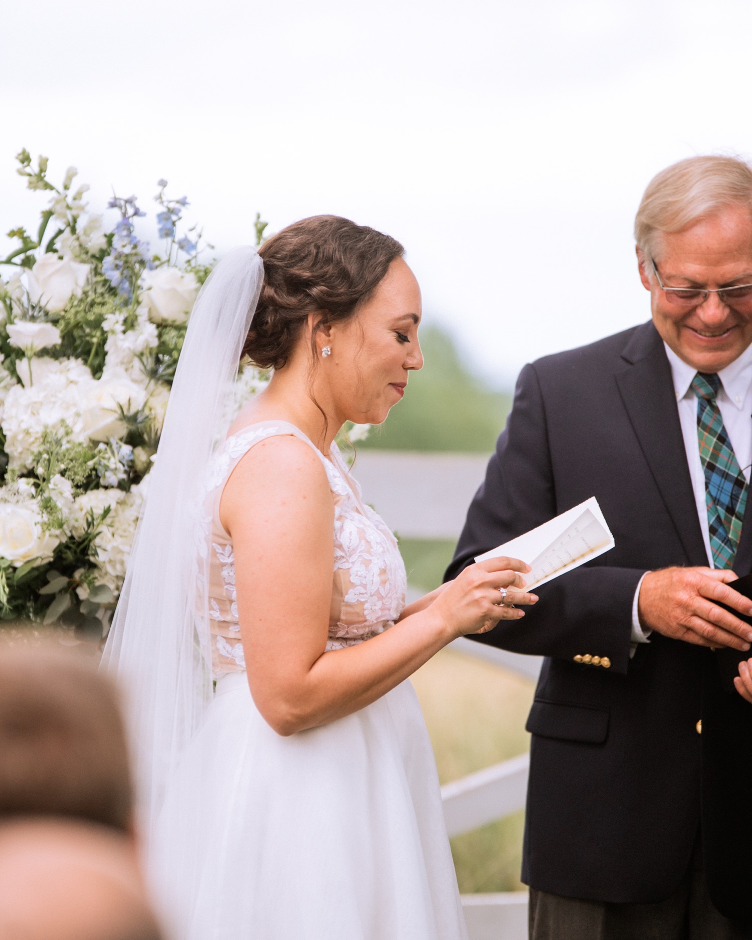 Bride reading vows during wedding at James Monroe's Highland in Charlottesville, VA wedding ceremony