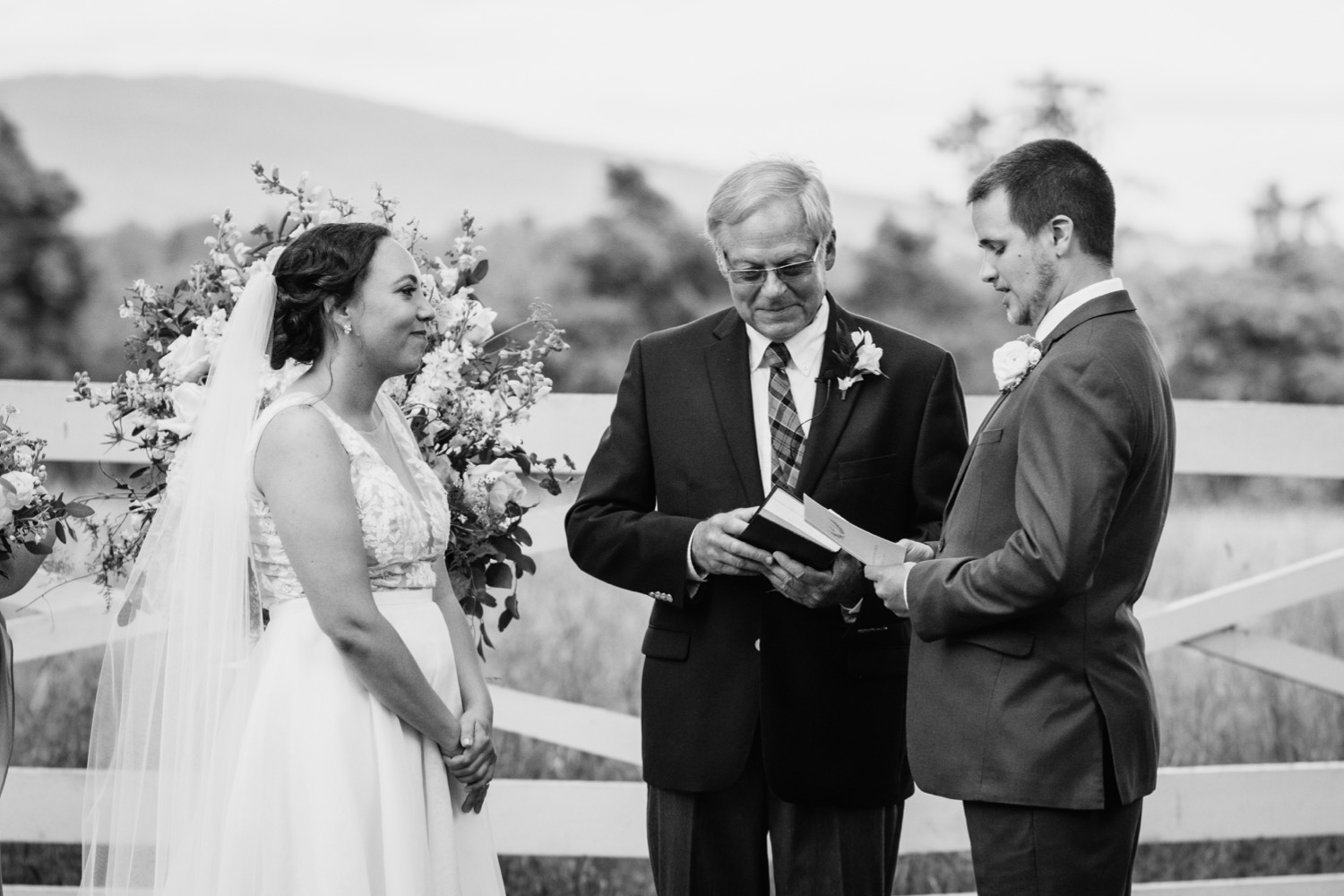 Groom reading vows during wedding at James Monroe's Highland in Charlottesville, VA wedding ceremony