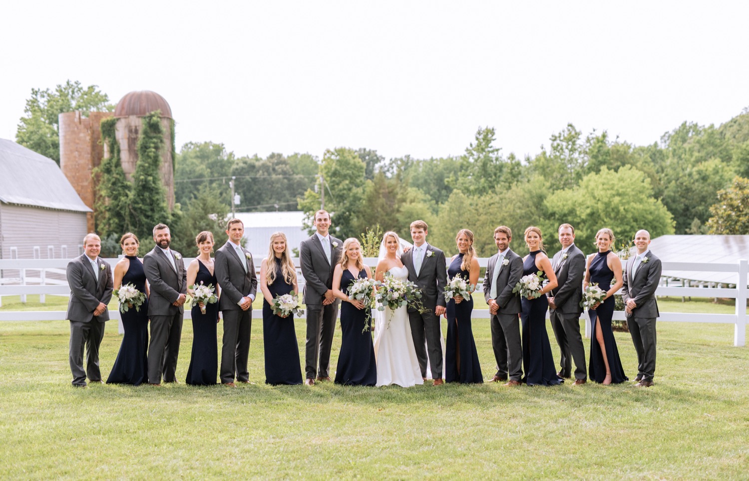 Entire wedding party celebrating with bride and groom after taking their vows at their wedding in Richmond, Virginia