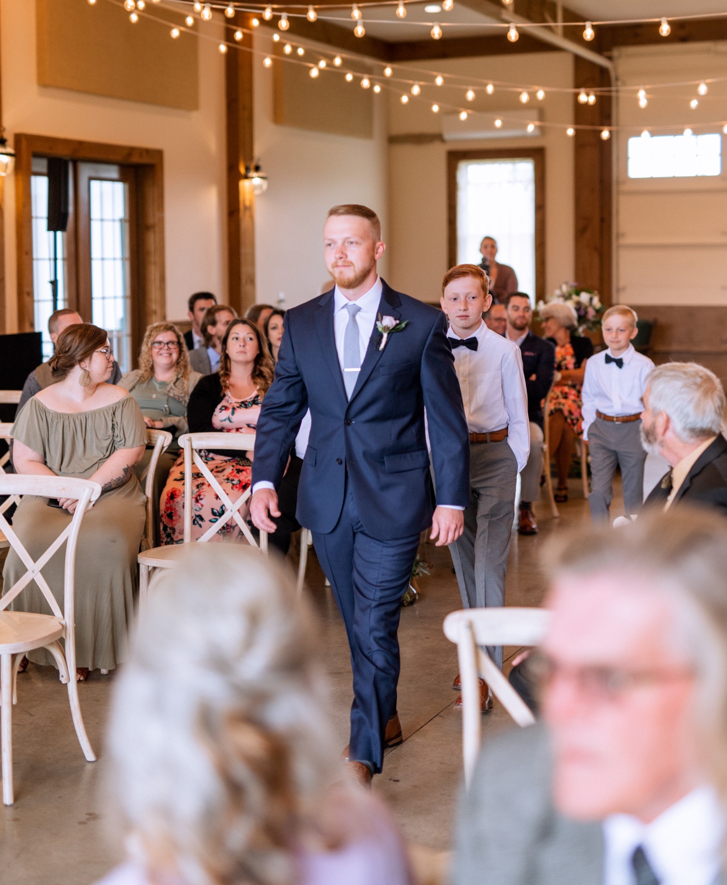 Groom walking down the aisle to meet his bride in Charlottesville, VA wedding