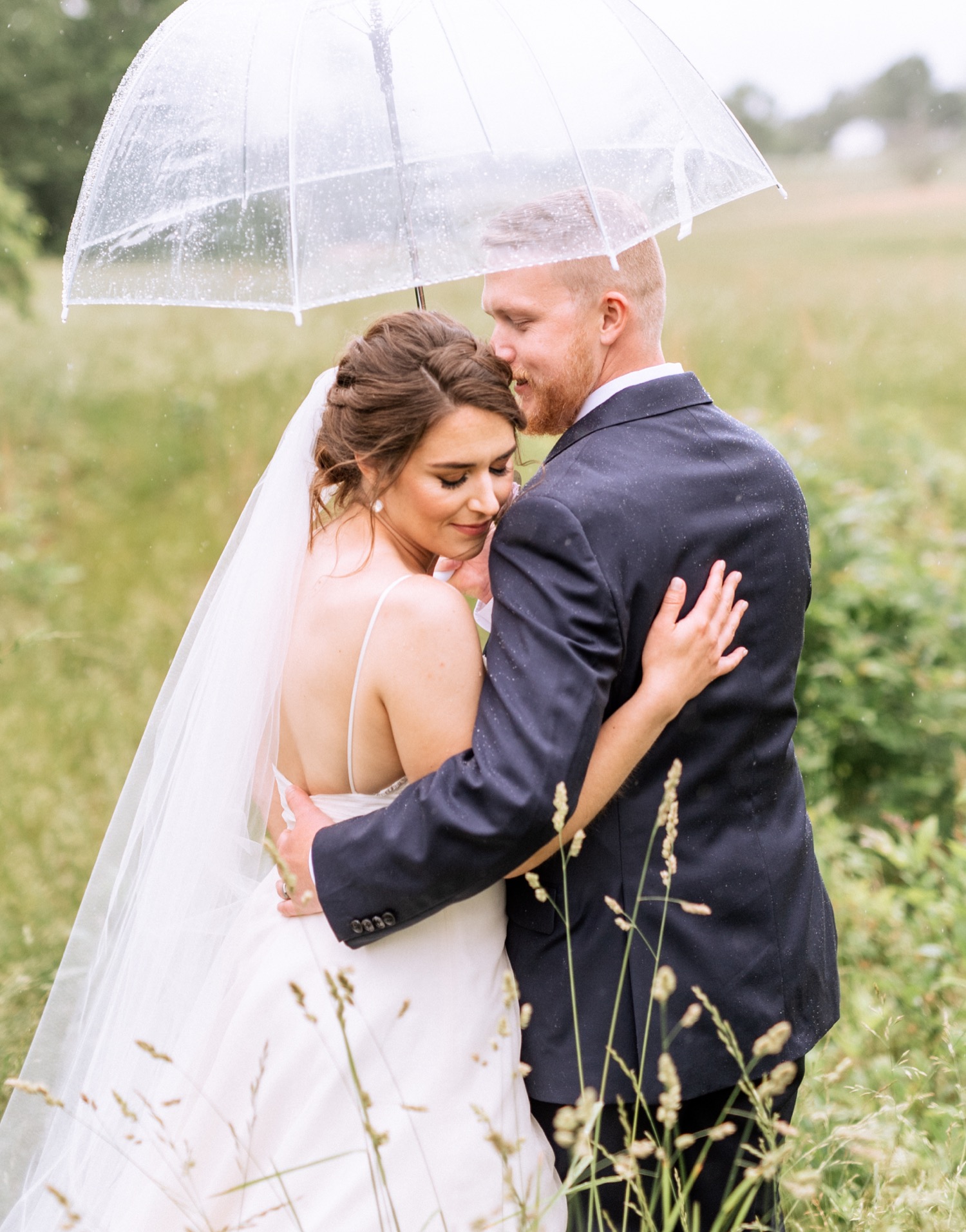 Bride and groom in the rain after wedding ceremony in Charlottesville, VA