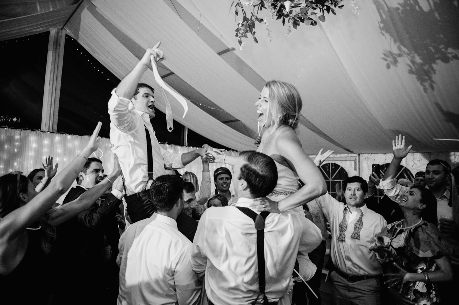 Bride and groom dancing with friends during their wedding reception at Amber Grove in Richmond, Virginia