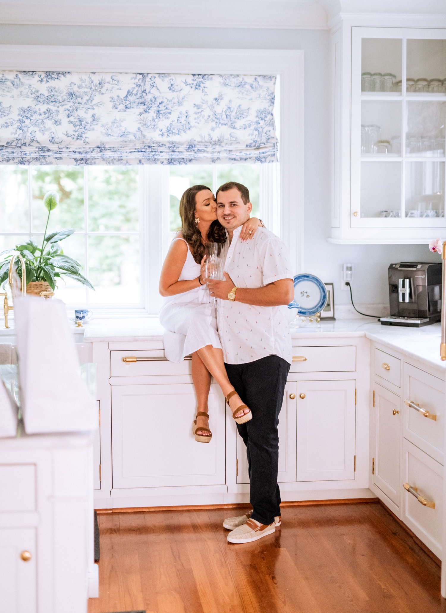 engaged couple hold each other close in kitchen at Cumberland Estate in Richmond virginia