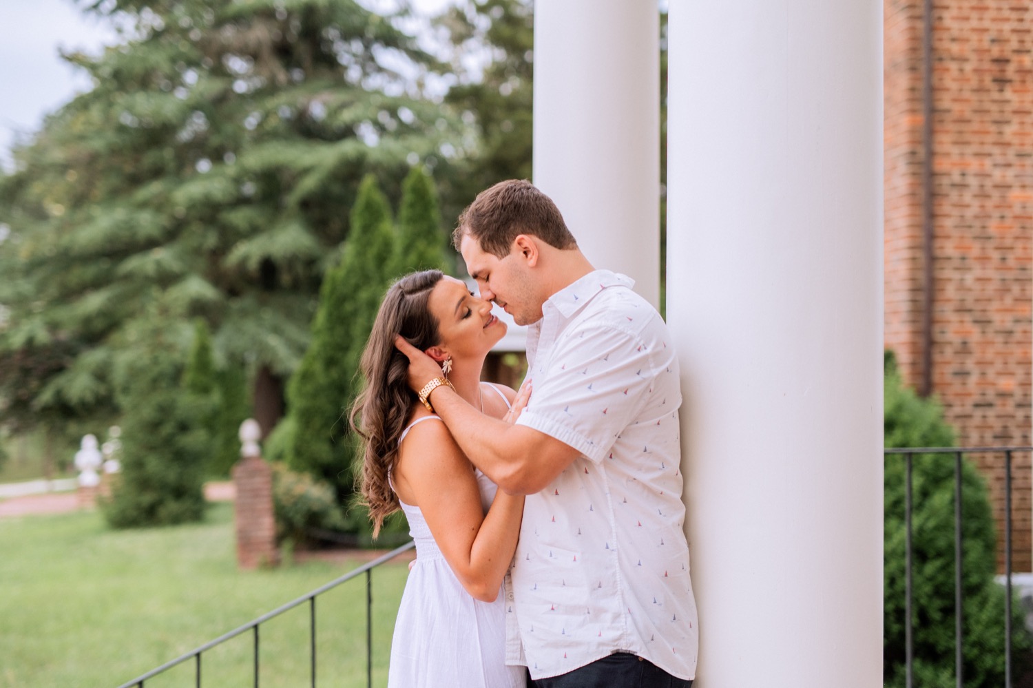 engaged couple hold each other close outside at Cumberland Estate in Richmond virginia