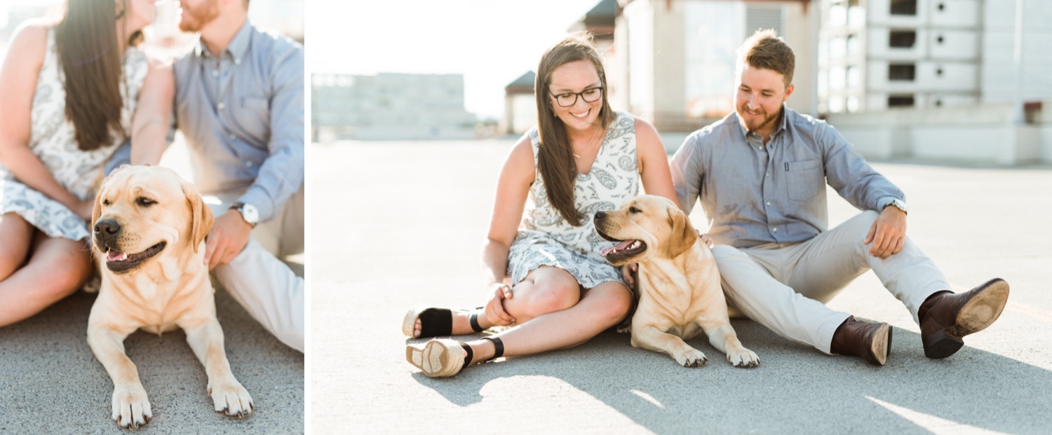 engaged couple cuddling and kissing their dog during engagement photoshoot