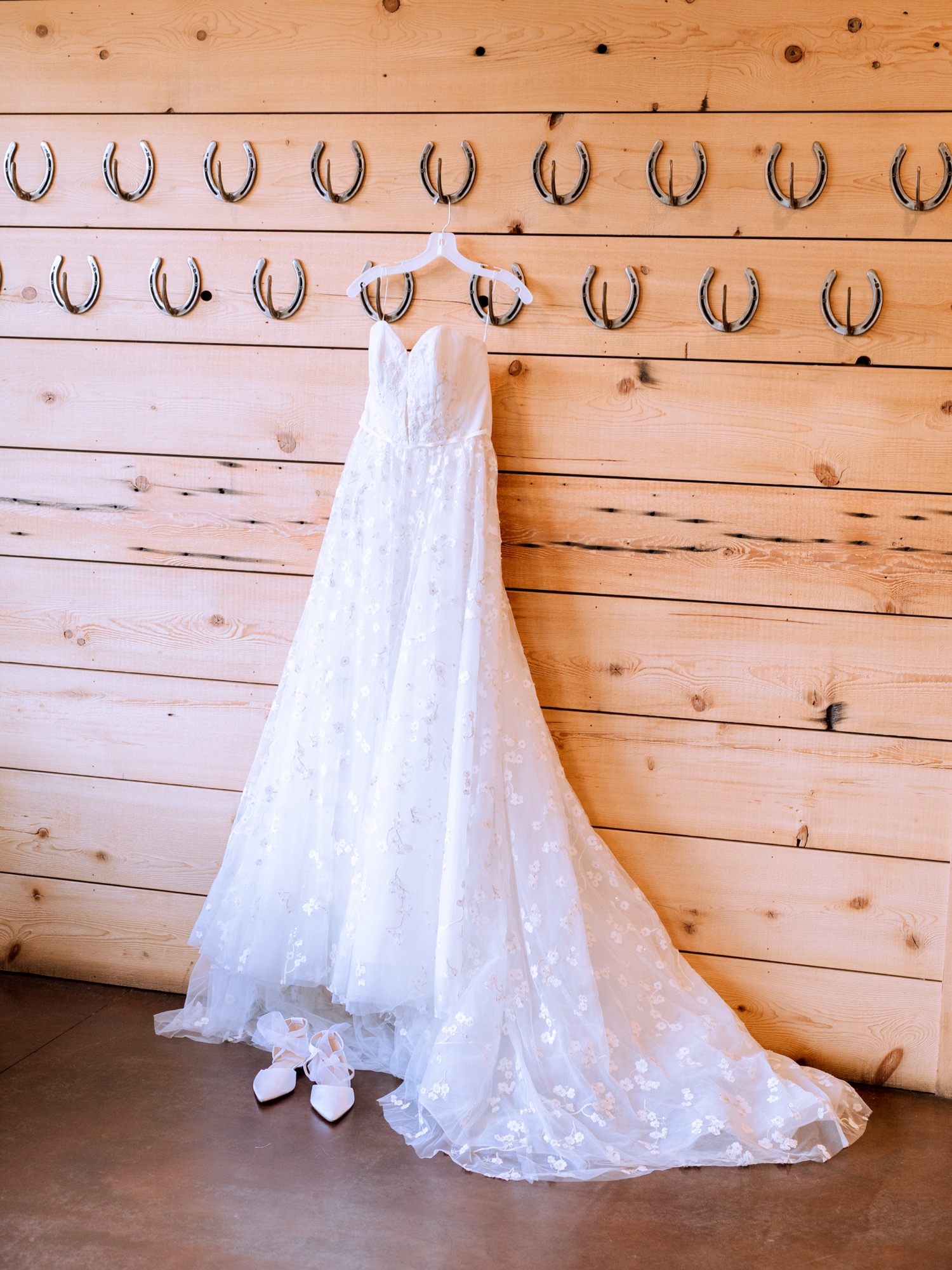 dress hanging on the wall of horseshoes at the king family vineyard in Charlottesville, Virginia
