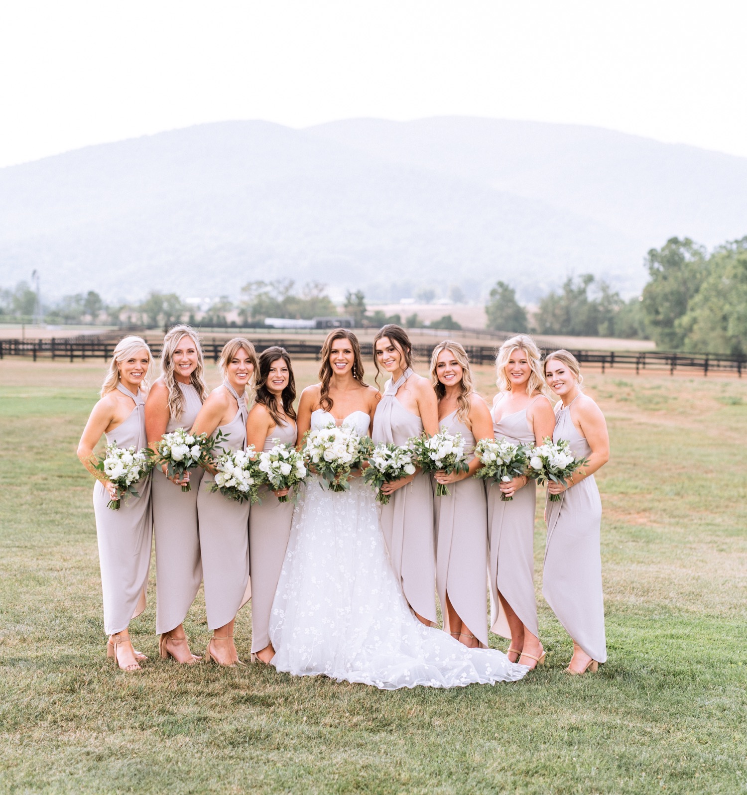 bride and bridesmaids in their taupe colored bridesmaids dresses celebrating the Charlottesville wedding day