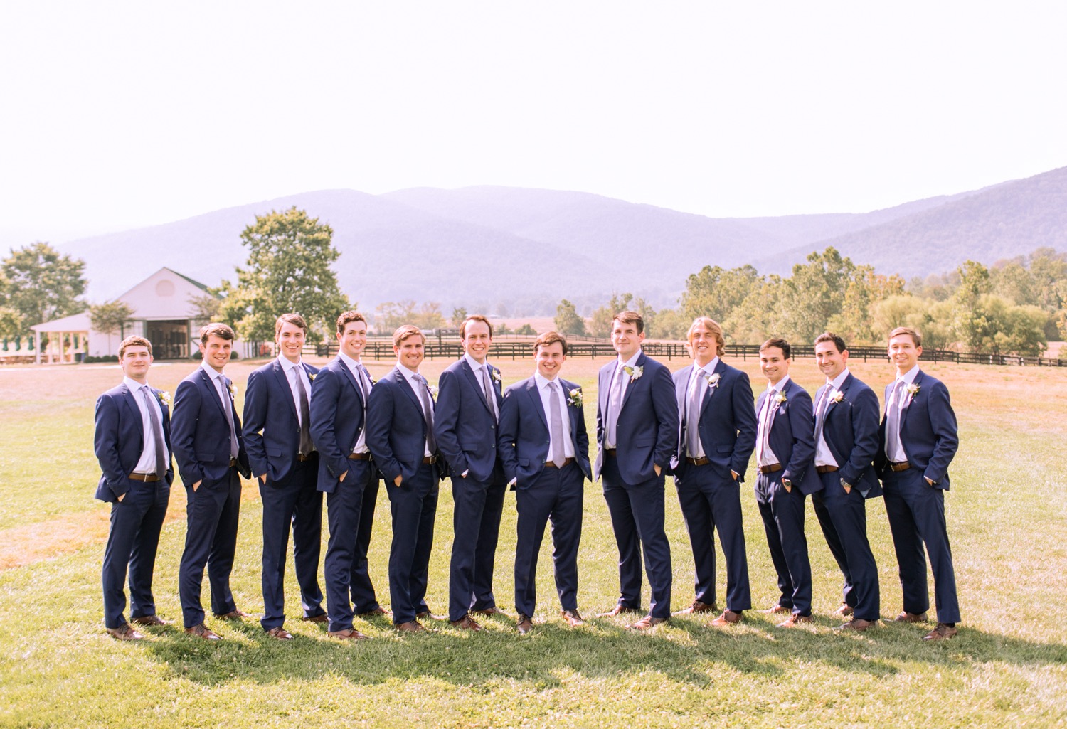 groom and groomsmen in their navy blue suits before the wedding ceremony begins