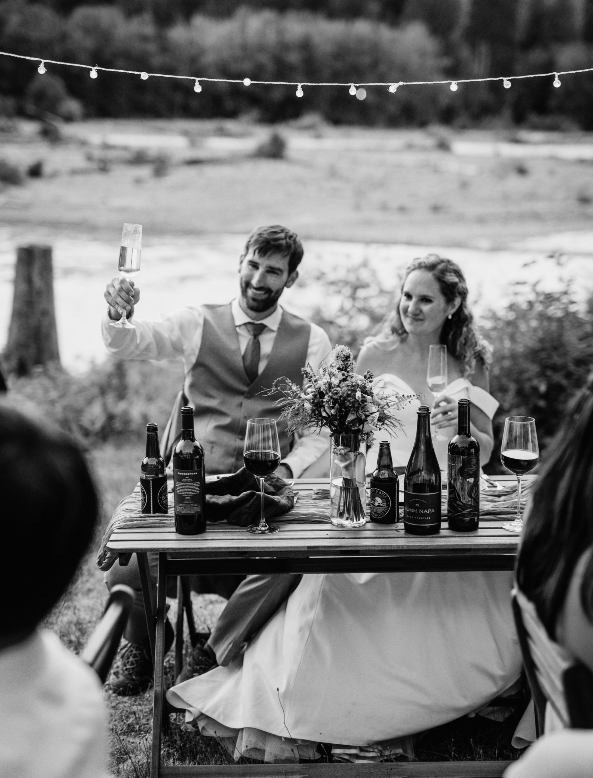 wedding party toasting to the bride and groom during the reception after the mt rainier elopement ceremony