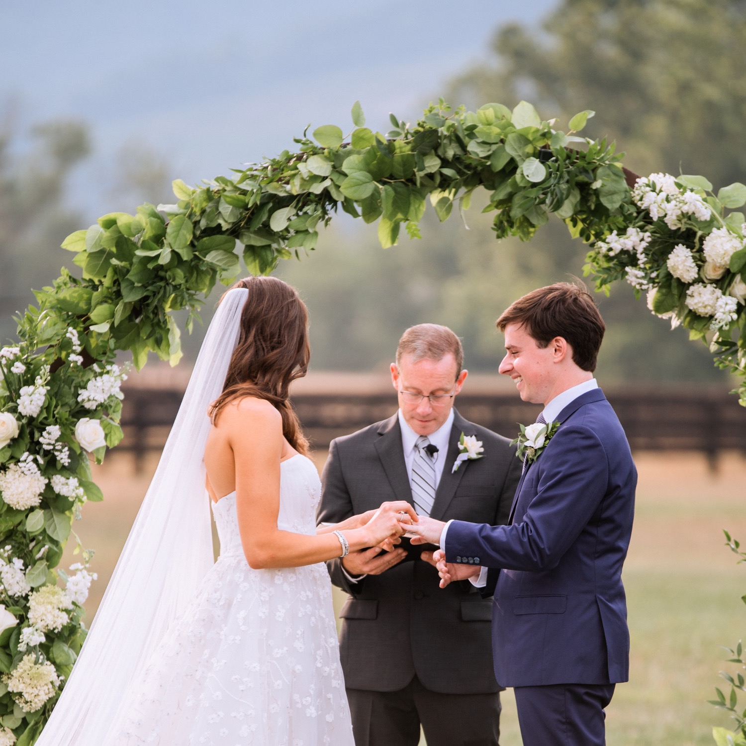 bride and groom at the alter during their Charlottesville wedding ceremony held at the King Family Vineyard