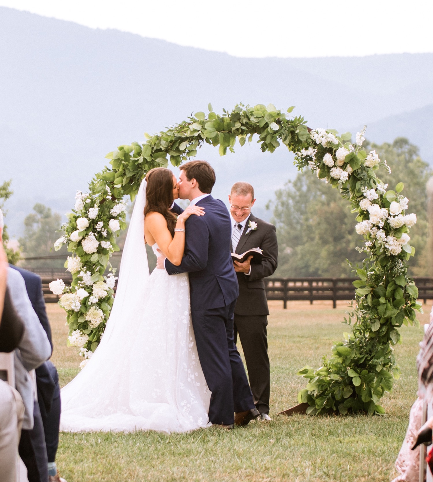 bride and groom at the alter during their Charlottesville wedding ceremony held at the King Family Vineyard