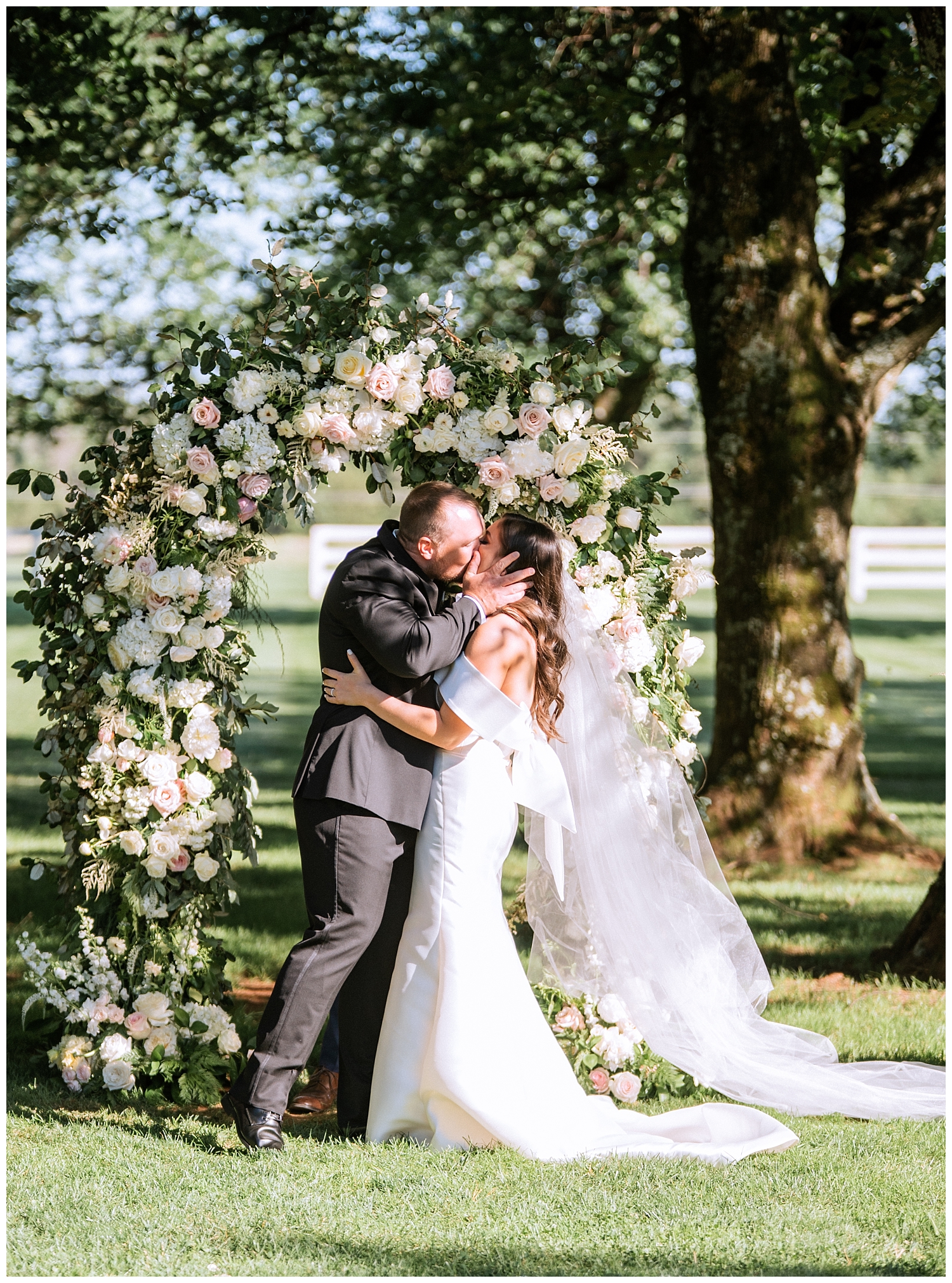 Bride and Groom's first kiss at Castle Hill Cidery wedding