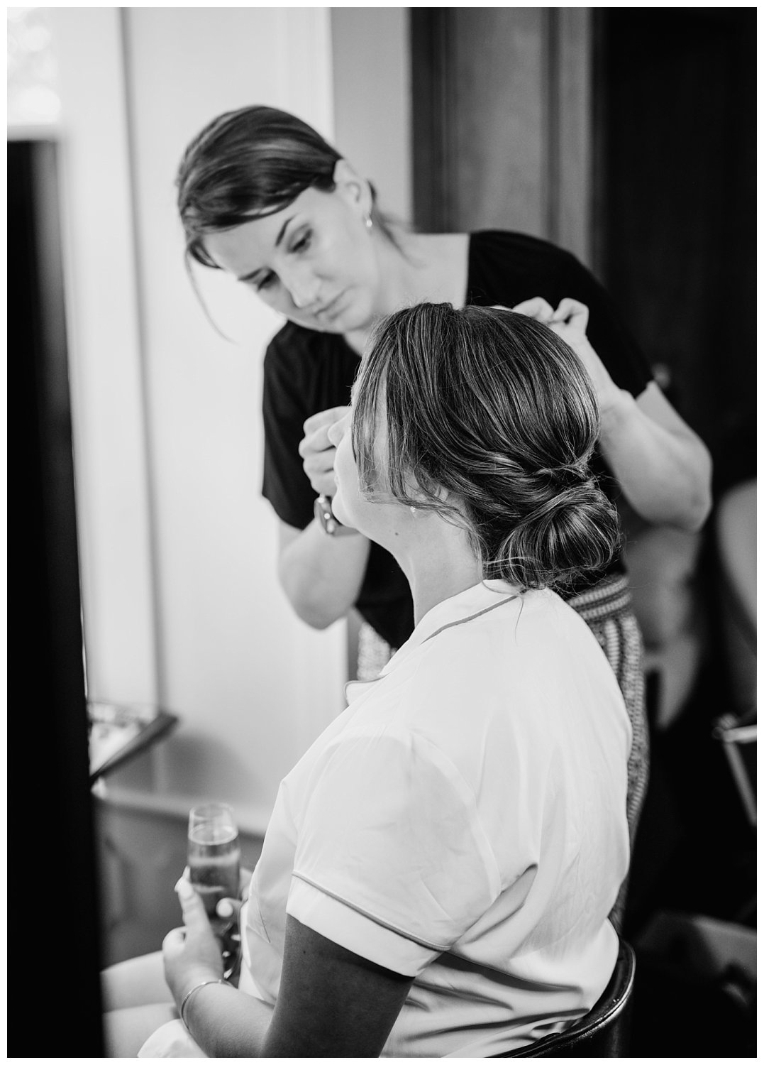 Bride getting her hair and makeup done