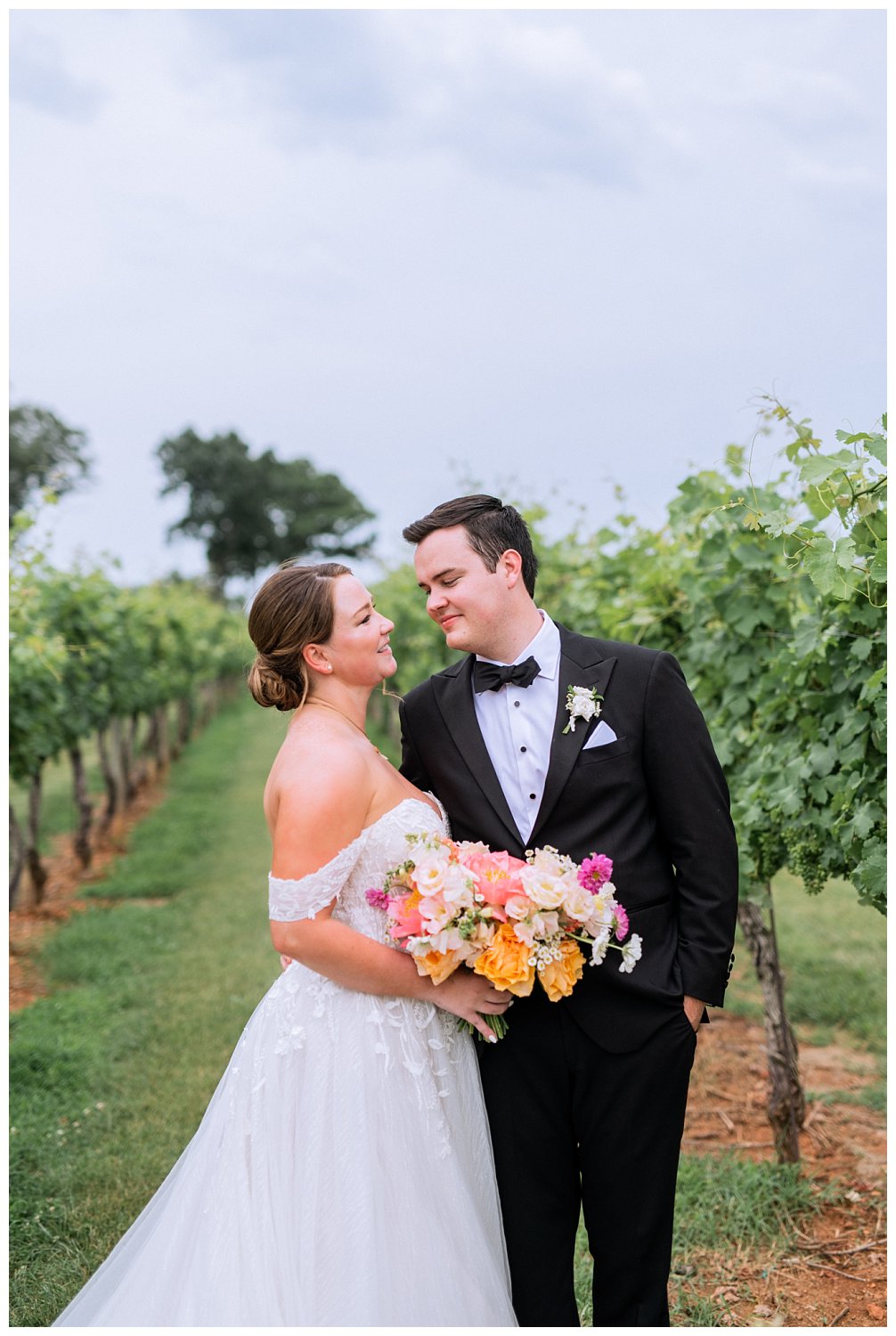 Bride and groom portraits at their colorful summer wedding