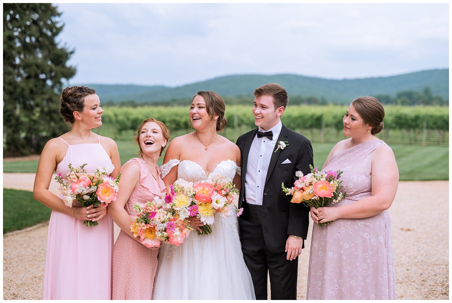 Colorful summer bridal bouquets with shades of peak, orange, and peach