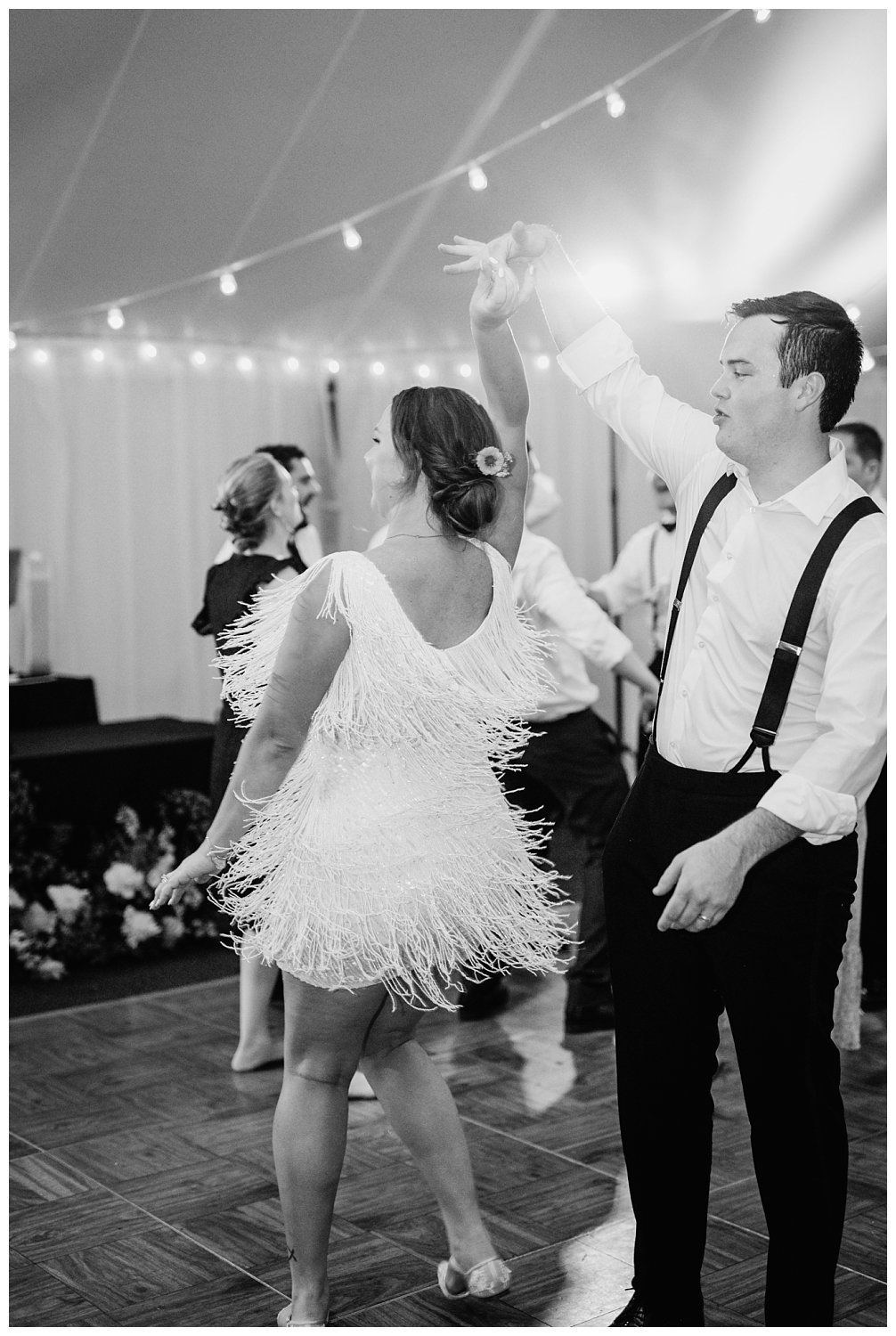 Lively dance floor at Keswick Vineyard summer wedding in Charlottesville, Virginia