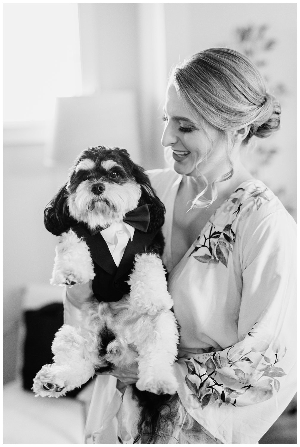 Bride getting ready with her dog at Early Mountain Vineyard in Charlottesville, Virginia