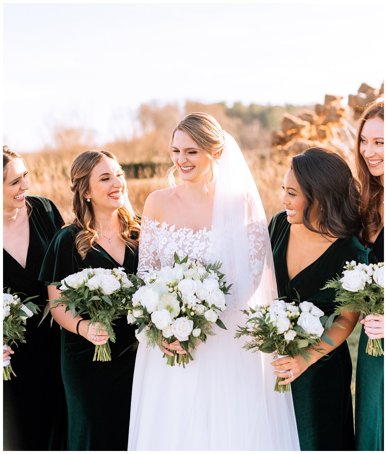 Bride with bridesmaids in velvet green dresses at Early Mountain Vineyard in Charlottesville, Virginia