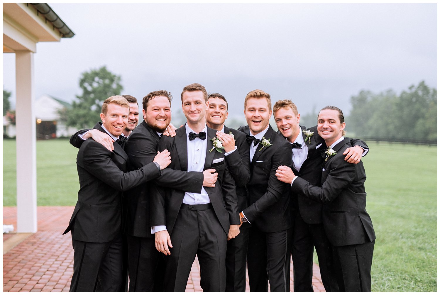 Groom with groomsmen in black tuxes 