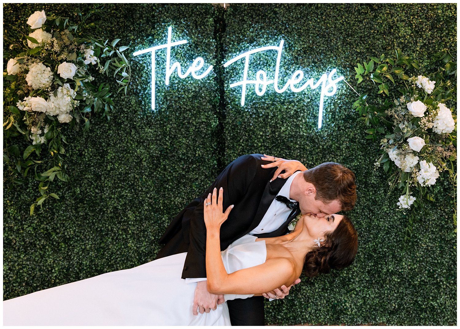 Bride and groom with custom neon sign at King Family Vineyard wedding reception