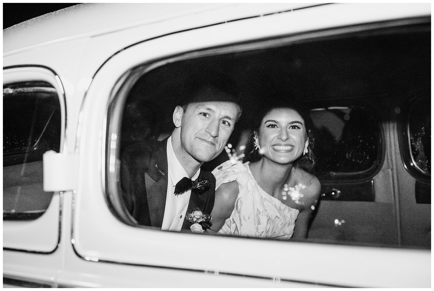 Bride and groom in getaway vintage car at King Family Vineyard wedding