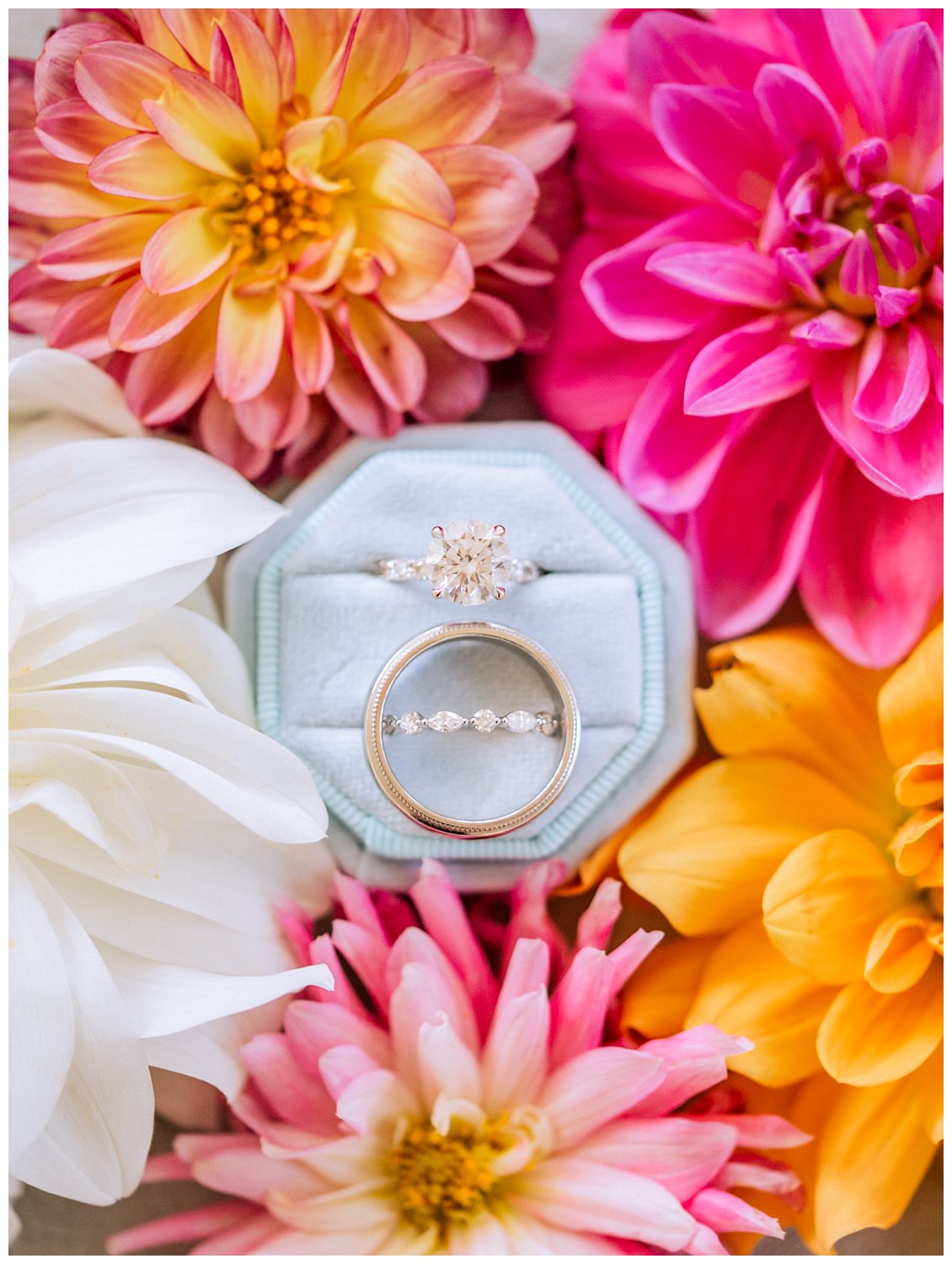 Wedding rings with vibrant pink florals at King Family Vineyard 